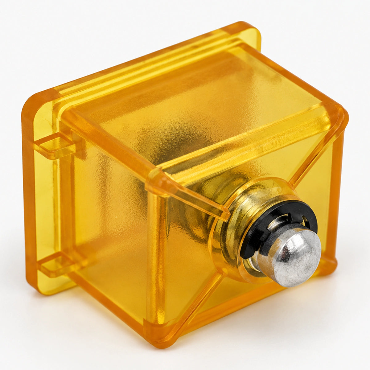 yellow coin reject button showing its internal spring and metal plunger