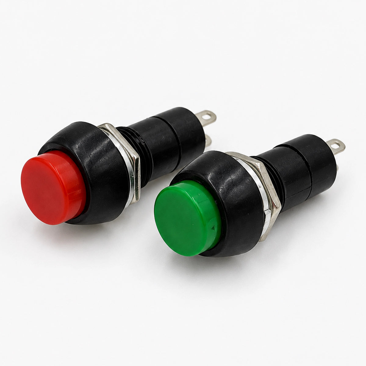 Red and green PBS-11B push-button switches shown at an angle with black bodies, metal mounting nuts, and two solder terminals.