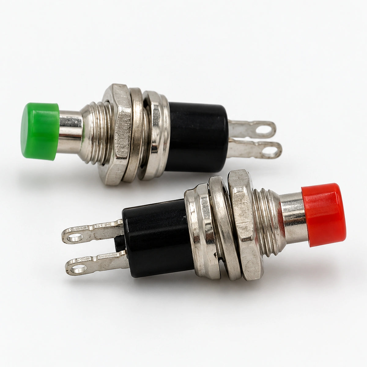 Red and green PBS-110 push button switches with extended plungers and threaded metal mounting sections.