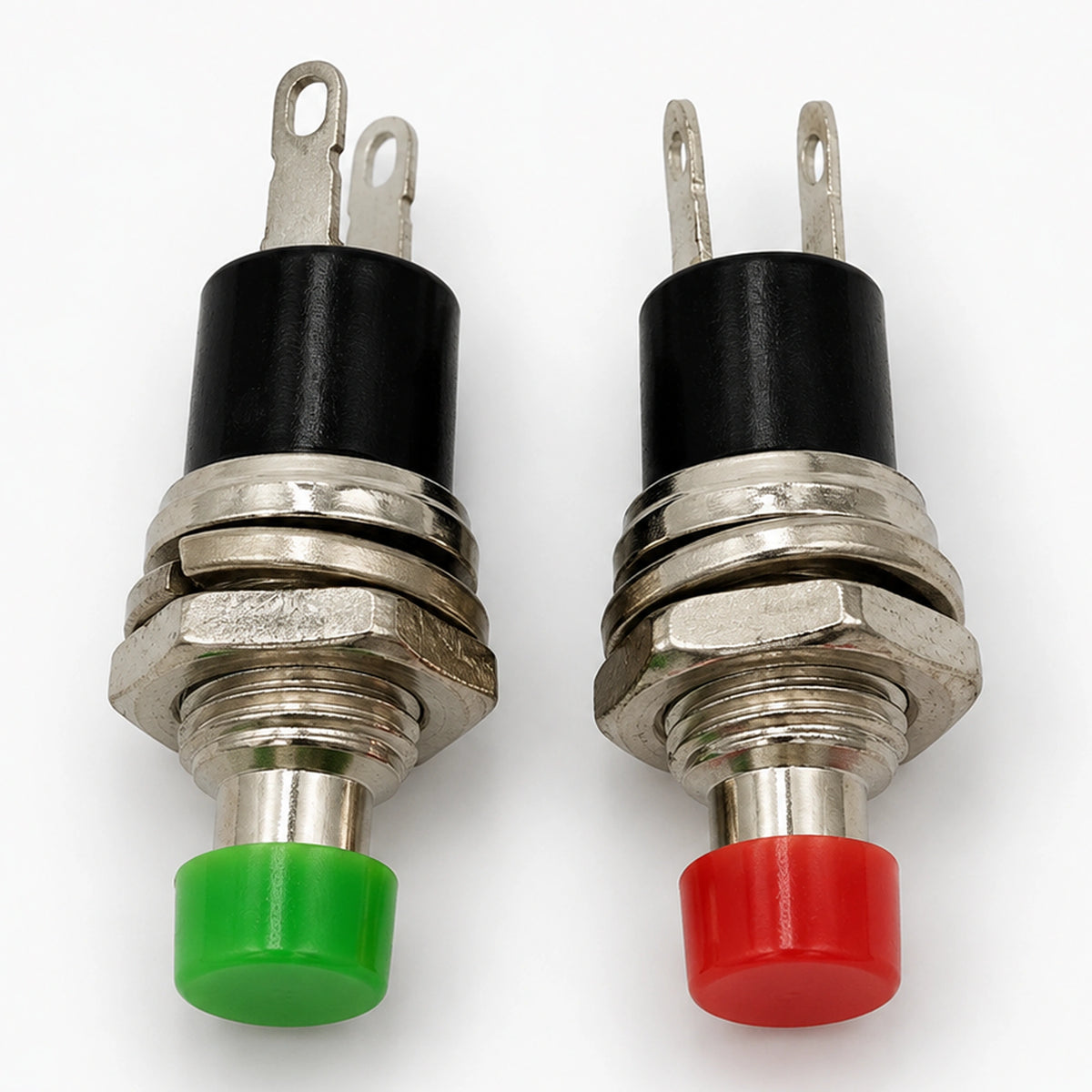Red and green PBS-110 switches with silver-colored plungers and black insulating bodies