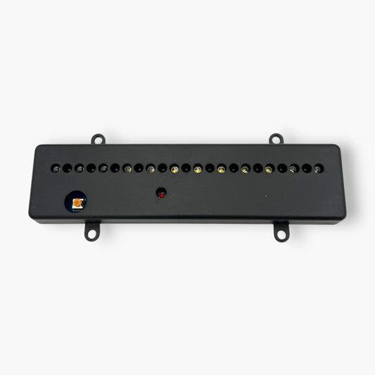black claw machine prize detection sensor showing slim enclosure and mounting tabs