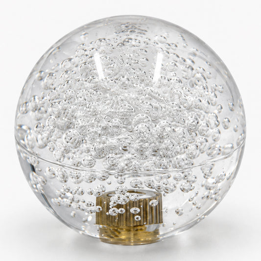 arcade joystick ball with internal air bubbles and a visible metal threaded insert.