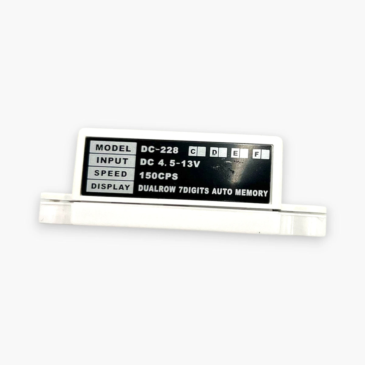 DOTCOM DC-228 counter spec label showing 150 CPS speed and dual-row 7-digit auto memory display
