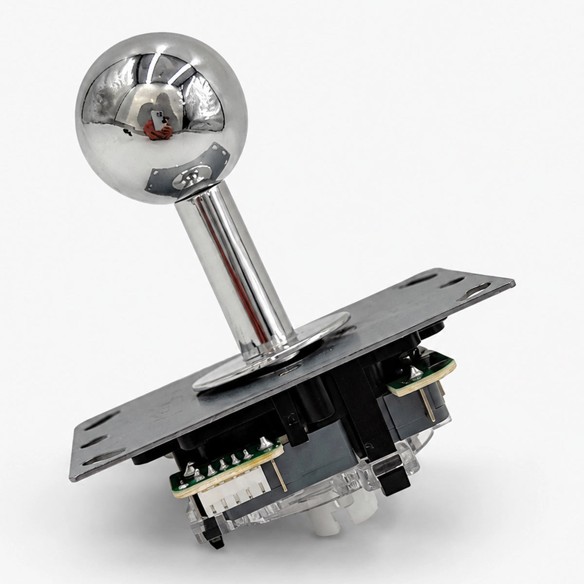 Arcade joystick with a reflective silver-colored ball top