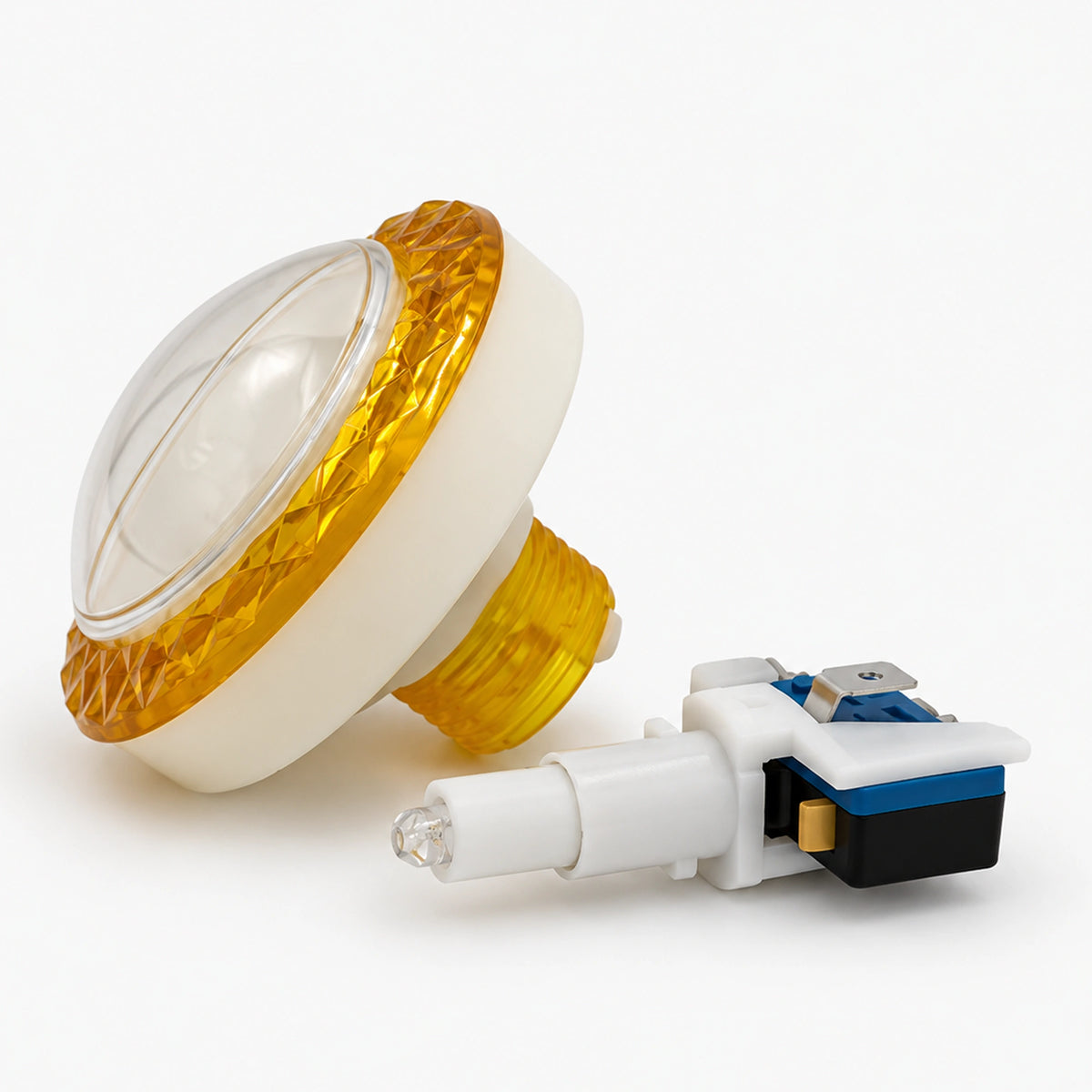 Assembled yellow diamond-patterned push button with a clear center cover and microswitch.